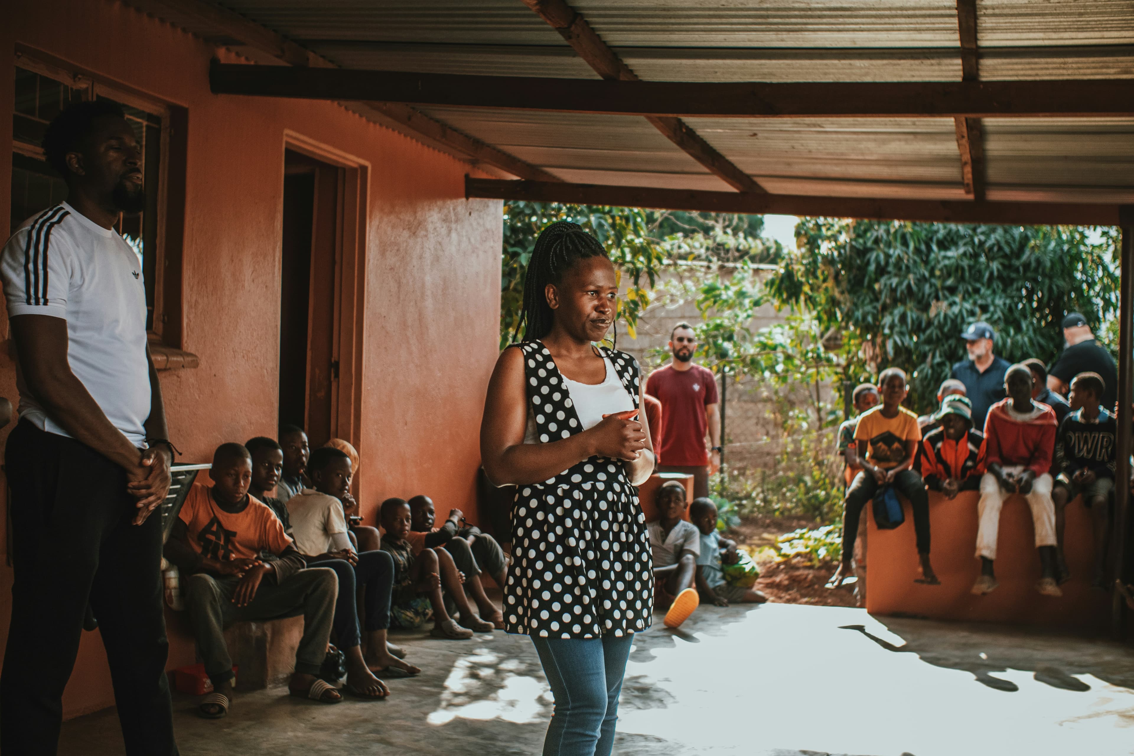 A community gathering in a school courtyard
