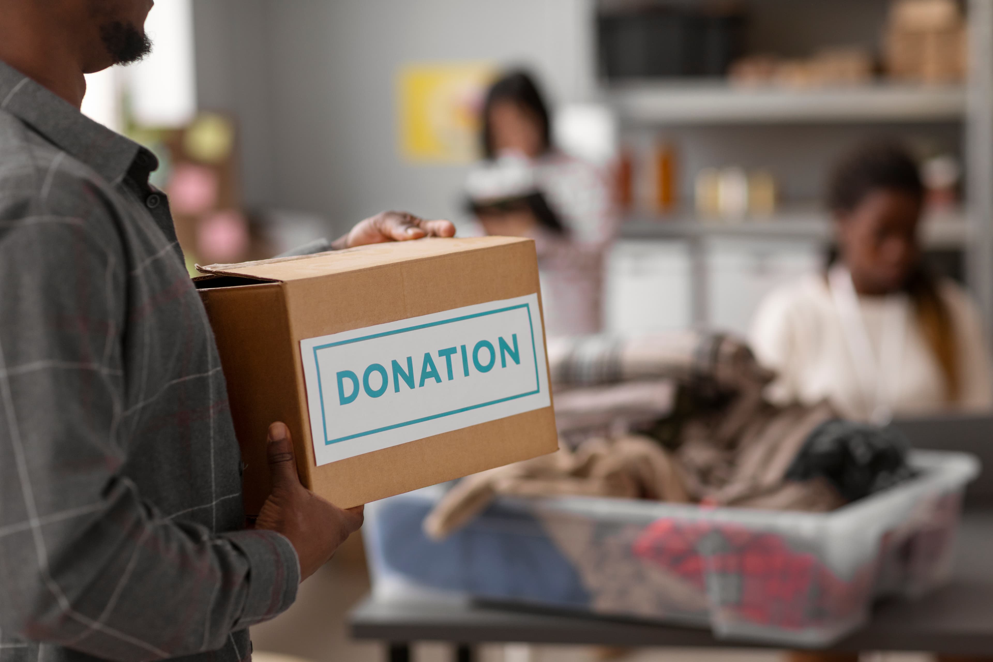 Volunteers packing community donation boxes